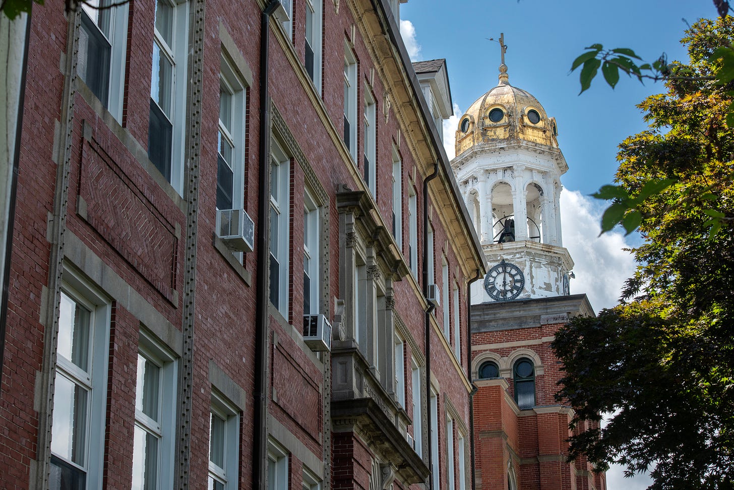 St. Mary’s golden dome rises between old brick buildings in Baltic