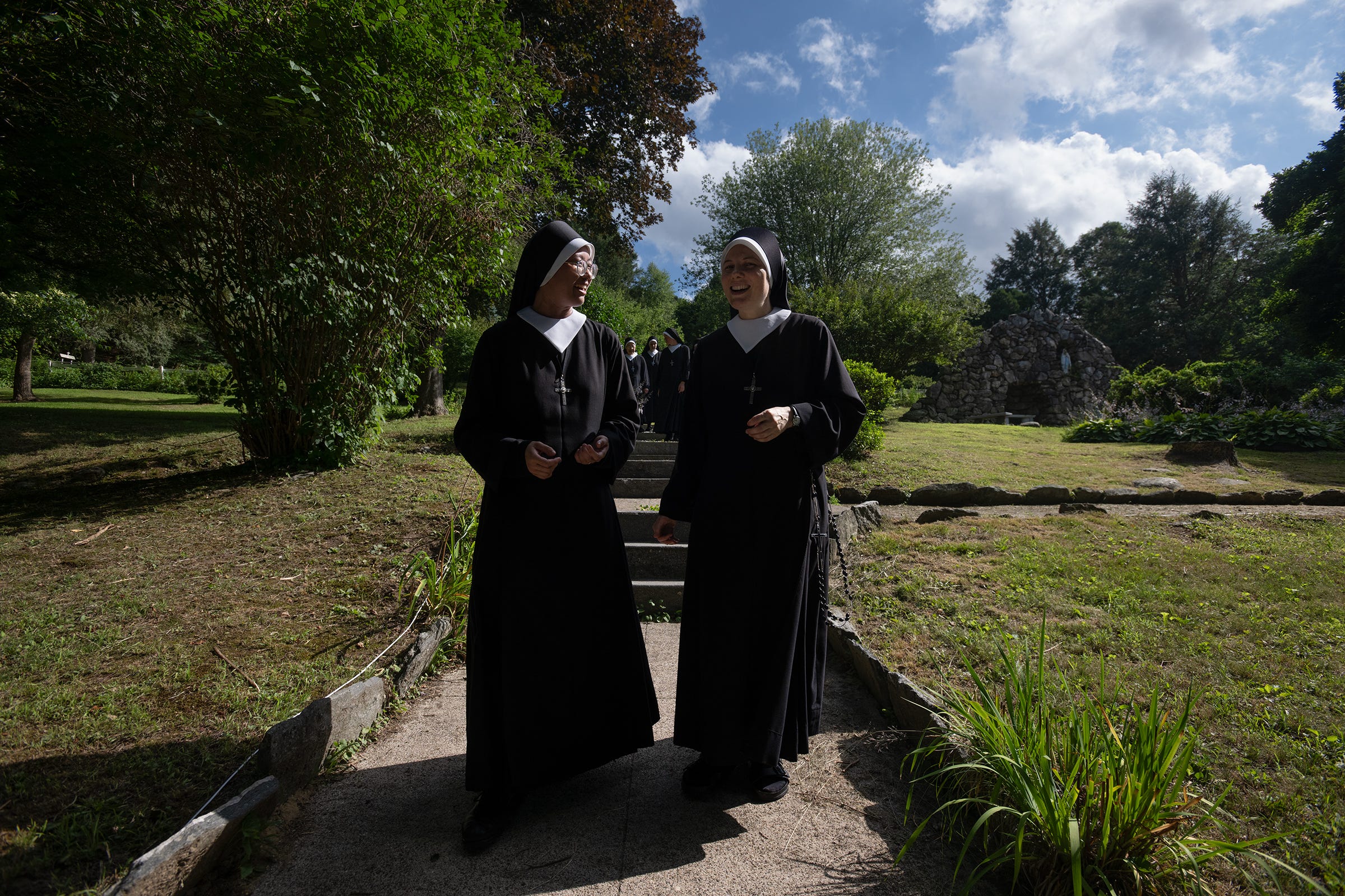 Two Sisters walk together on the grounds of the Motherhouse