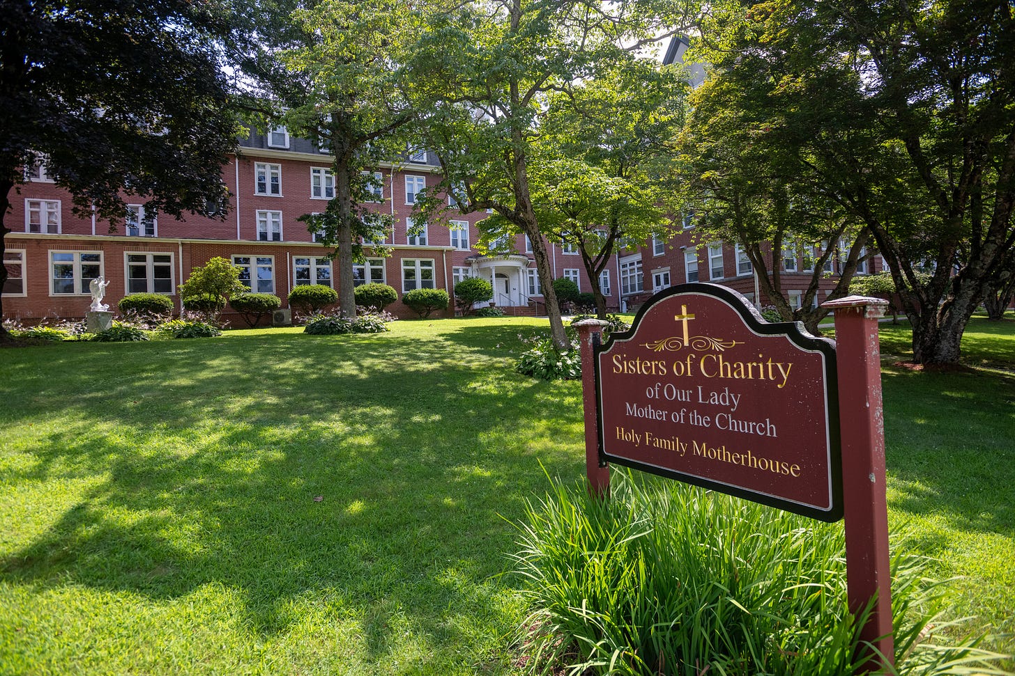 The entrance sign and brick buildings of the Sisters’ Motherhouse