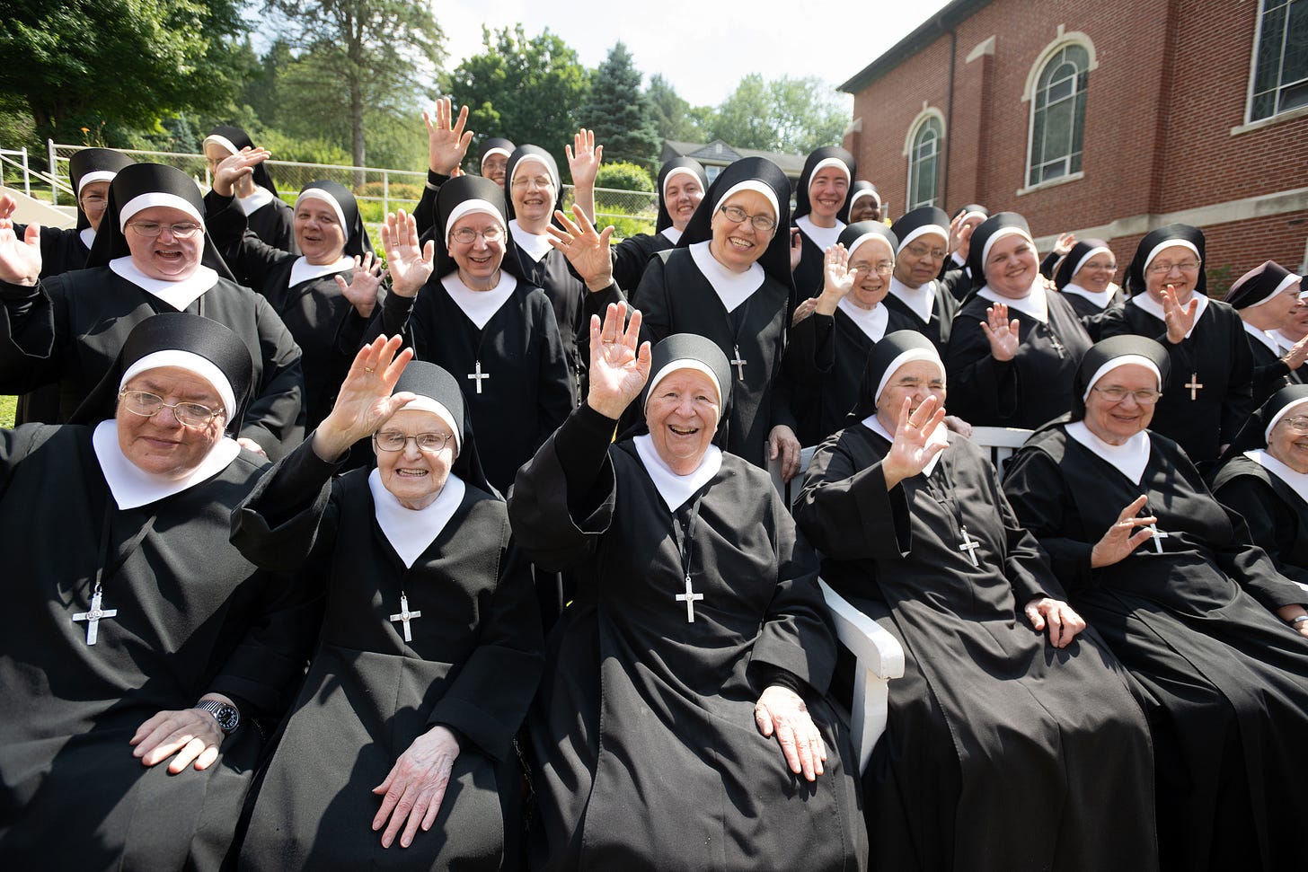 The Sisters fill the courtyard for their community portrait