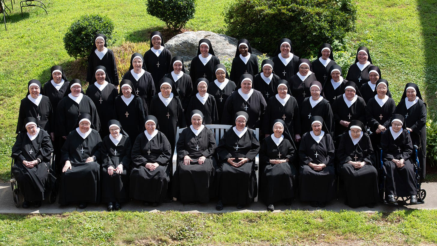 A formal portrait of the Sisters of Charity of Our Lady, Mother of the Church