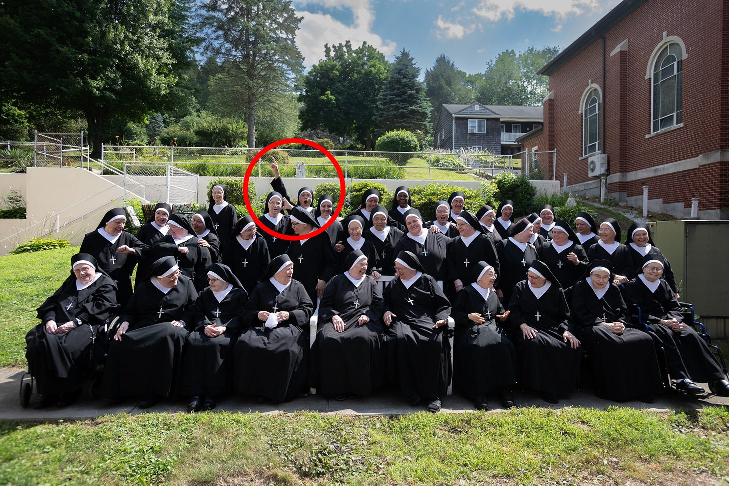 The formal community portrait with one Sister playfully circled in red